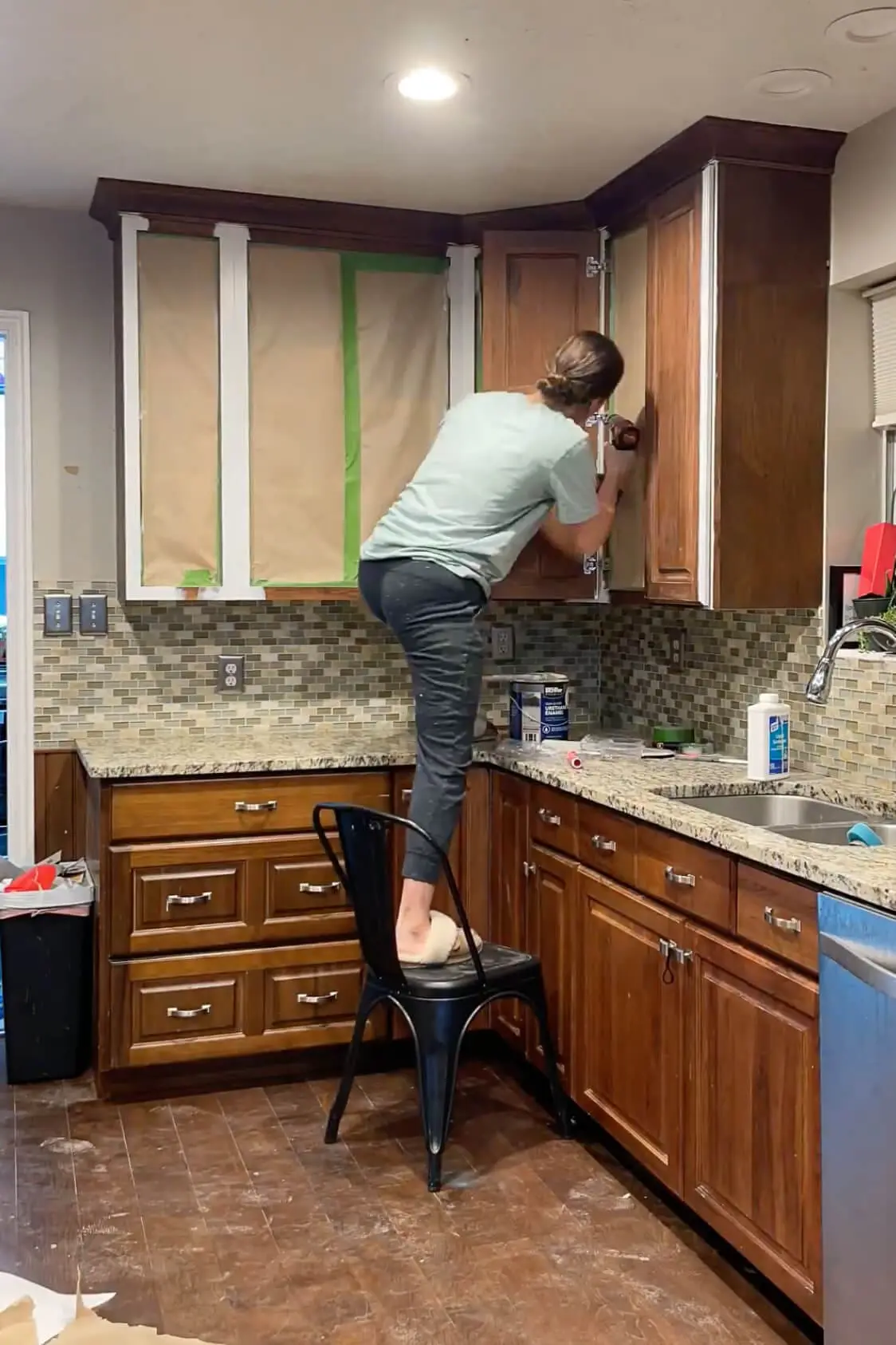 Putting doors back on kitchen cabinets getting ready for paint. 